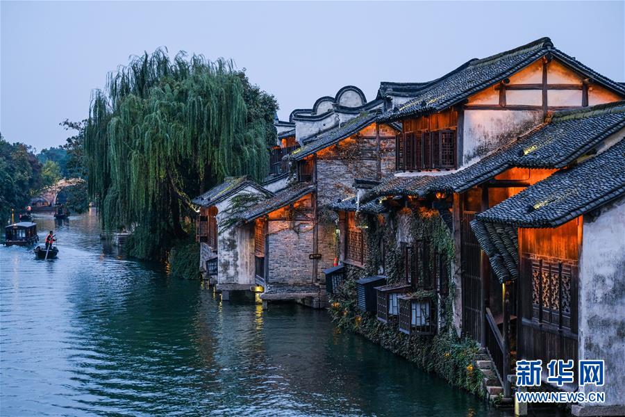 (慶祝改革開放40周年基層行·鄉鎮篇·圖文互動)(1)烏鎮40年:根里的靜與脈中的動